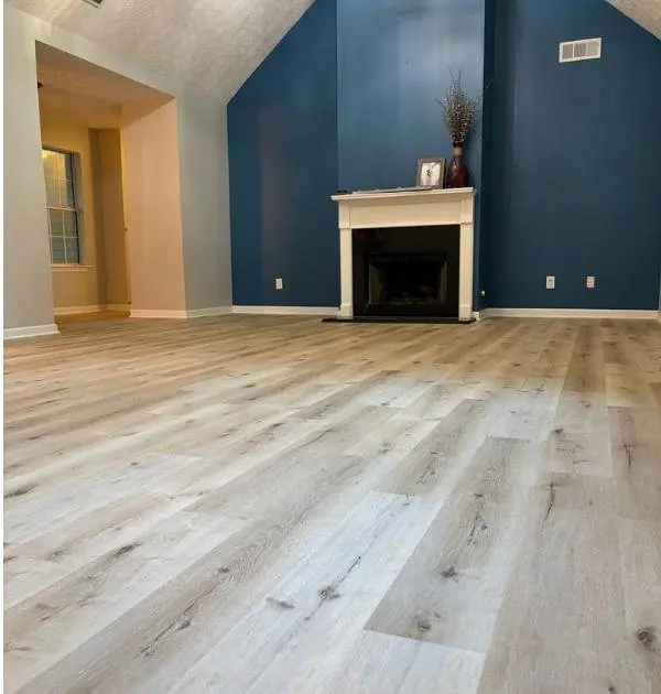 After: living room with light gray wood-look flooring