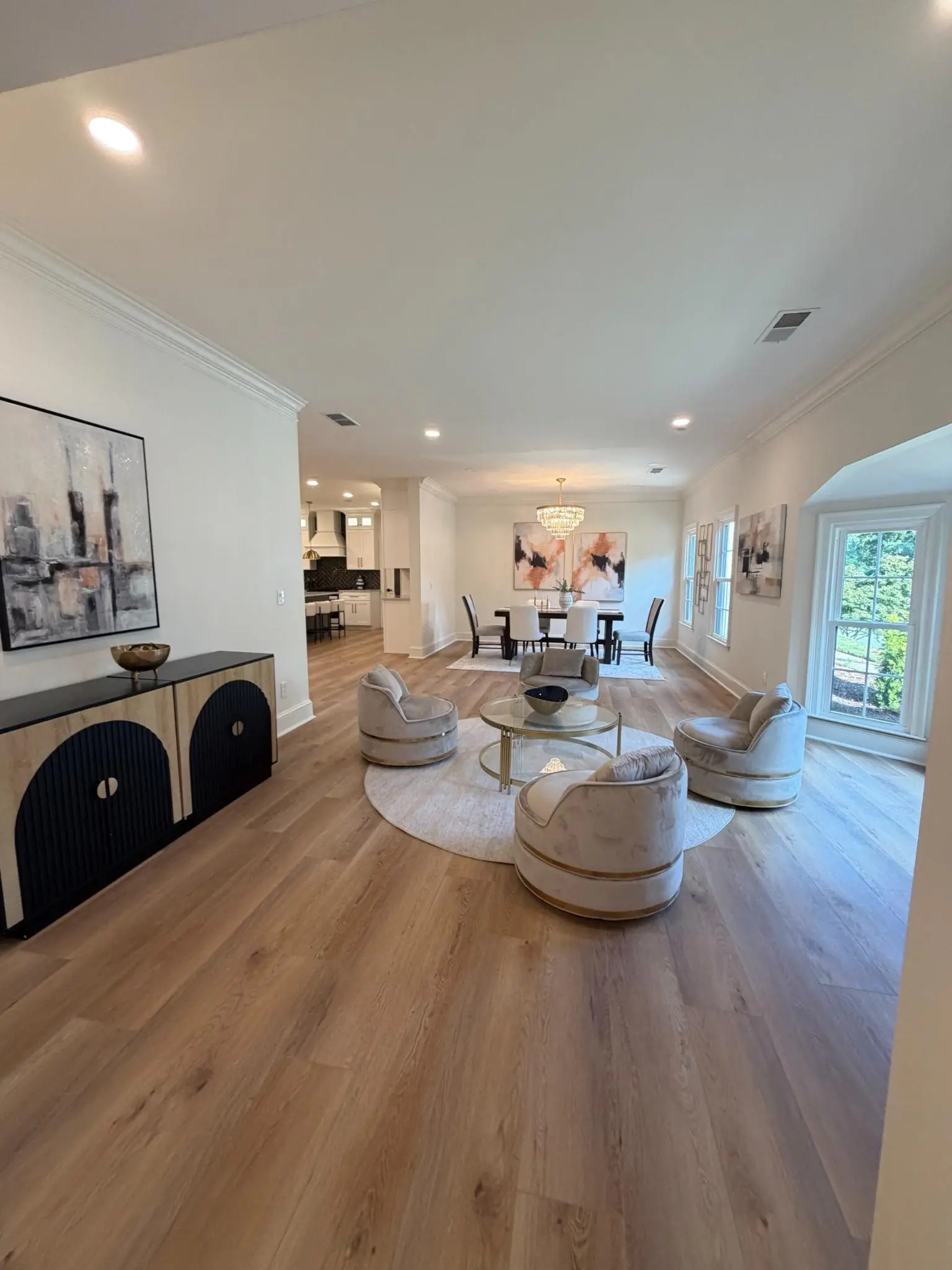 Bright living room with wide light wood flooring