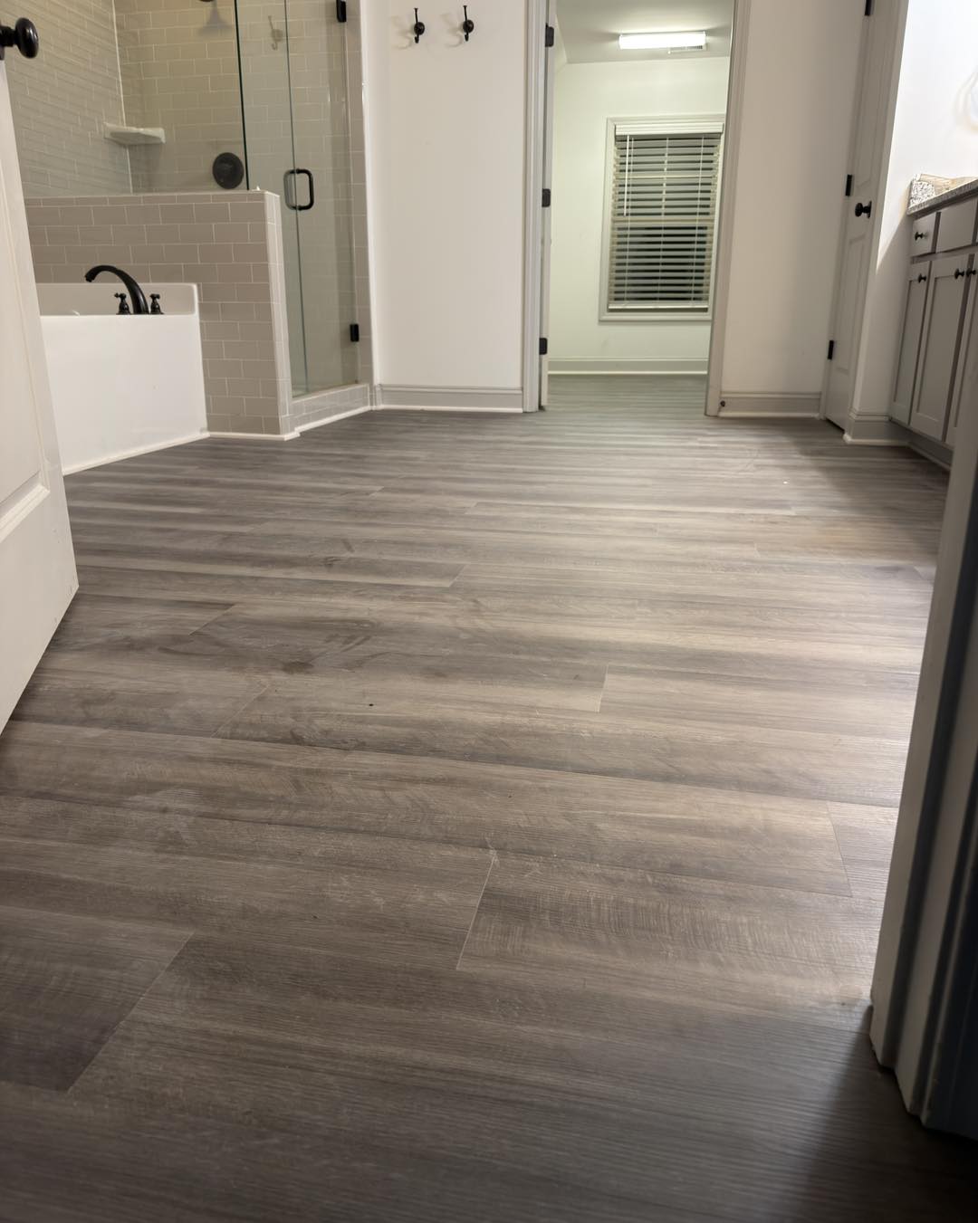 Open kitchen and living space with light oak floors